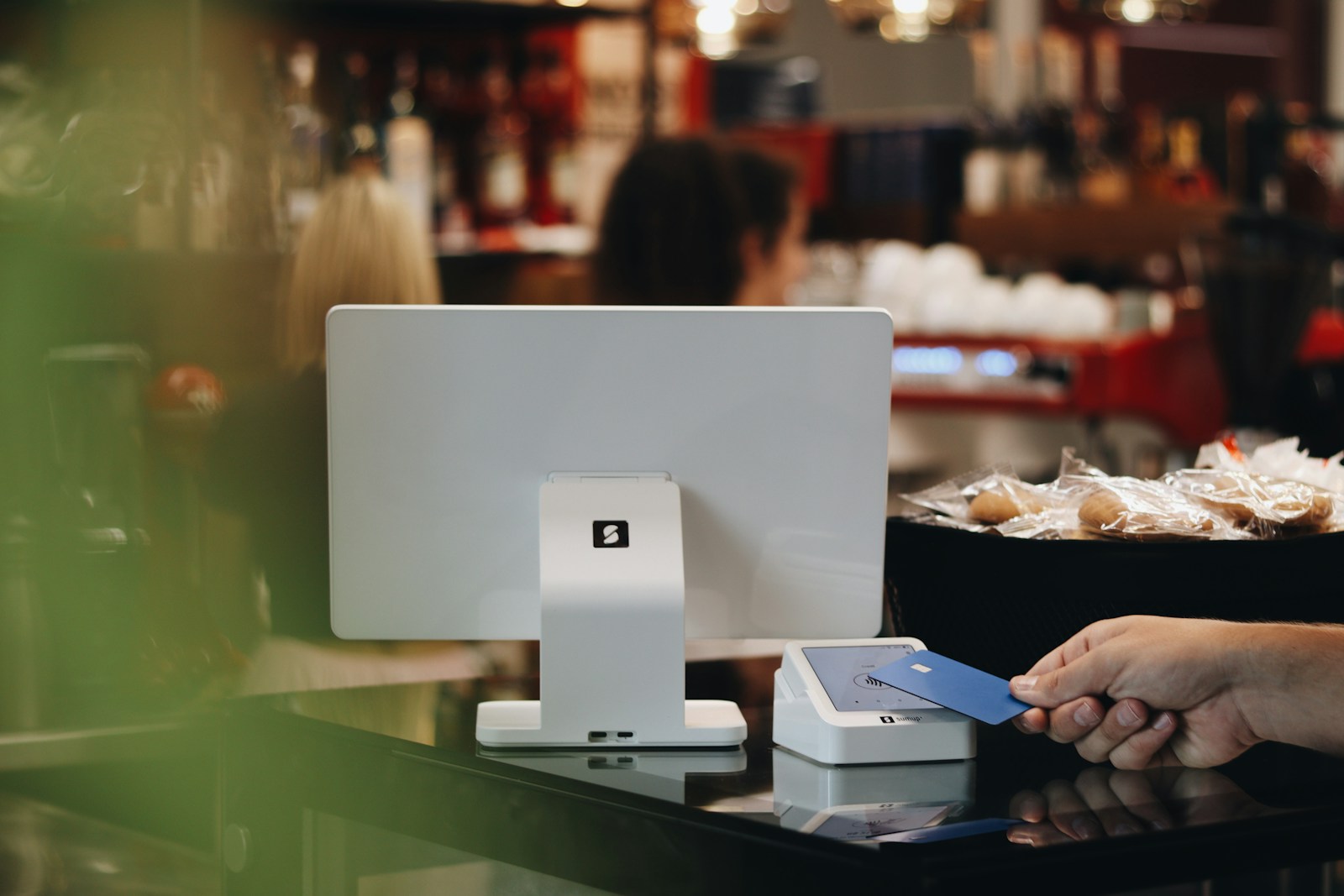 A person sitting at a desk in front of a computer